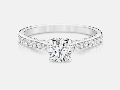Taylor style engagement ring set with 40 side round brilliant diamonds totaling 0.32 carats.  Center stone sold separate.  $1850.00