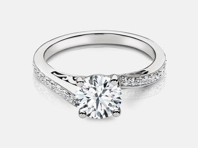 Petra style engagement ring set with 18 diamonds totaling 0.18 carats. Center stone sold separate. $1450.00